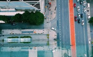 A tarmac road with cars on it from a top view