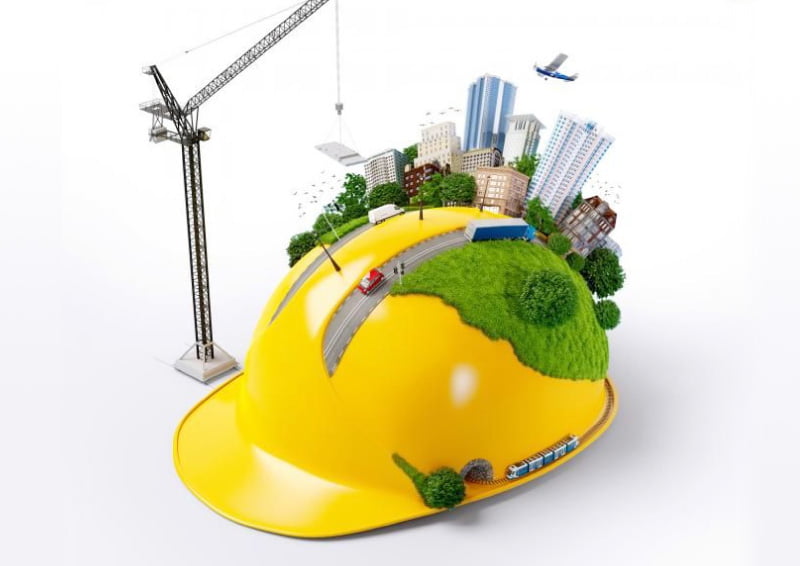 An illustration of a construction hat with a green city on it